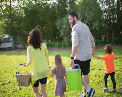 family enjoying a relaxed weekend outdoors in a local park